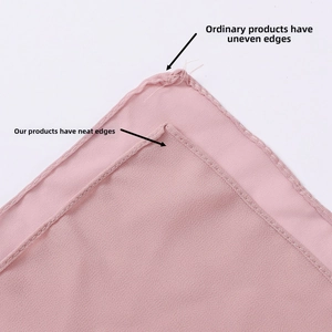 Detail comparison showing high-quality flat stitching versus irregular edges on pink chiffon shawl