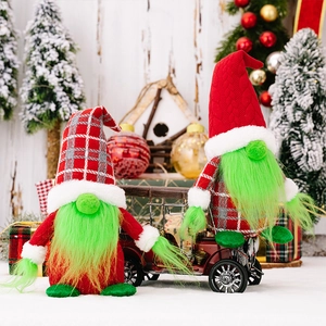 Detail of Christmas gnomes with long green beards and festive red hats in a holiday scene