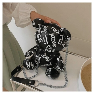 Detailed view of trendy graffiti bear crossbody bag with silver chain strap and PU leather