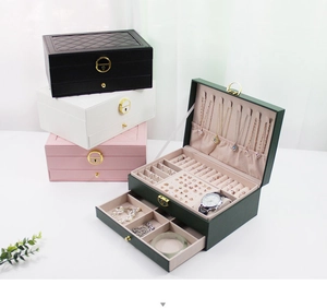 Close-up of faux leather jewelry box details with quilted texture and metal lock buckle
