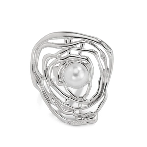 Detail of irregular silver alloy wrap ring with a central white faux pearl accent