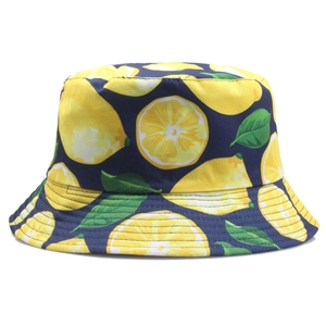 Unisex navy blue canvas bucket hat featuring vibrant yellow lemon fruit patterns