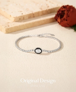 Detail of S925 silver tennis bracelet with black enamel oval zircon and pavé setting