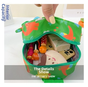 Detail view of green dinosaur kids bag interior showing ample storage for small items