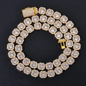 Macro detail of gold plated iced out chain with zircon crystals and secure box clasp