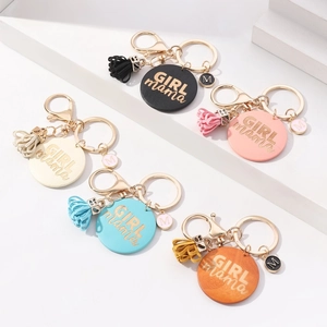 Handmade GIRL MAMA wooden keychain set with colorful tassels and gold M pendant