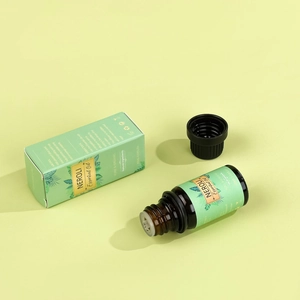 Organic Neroli Essential Oil 10ml bottle with packaging box in natural green setting