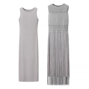 Detail of gray two-piece knit dress featuring sleeveless inner and fringe overlay design