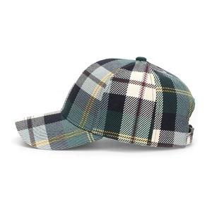 Detailed view of green plaid baseball cap showing fabric texture and adjustable buckle