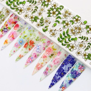 Floral nail foil transfer set with colorful starry rose patterns on clear false nails