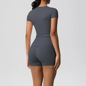 Rear view of dark grey slim-fit athletic set showing high-waisted shorts and lift effect