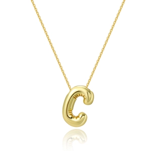 Macro detail of glossy 18K gold plated letter C pendant with elegant metal texture