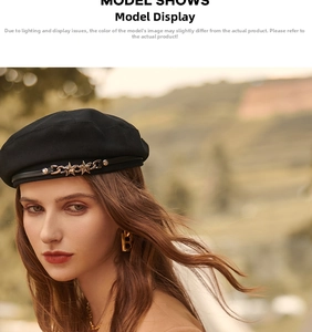 Detail of black wool beret featuring a stylish metal chain and star-shaped badge accents