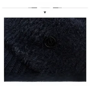 Macro detail of dark blue faux mink fur knit cap with decorative black round side button