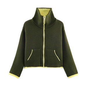 Close-up of contrast zipper and high neck detail on olive green fleece jacket