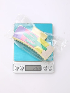 Detailed weight measurement showing beige cactus leather hair clip at 26.9g on scale