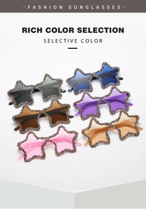 Flat lay of star-shaped sunglasses with colorful lenses and rhinestone-embedded frames