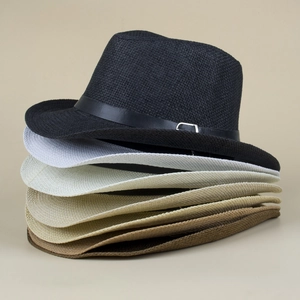 Vertical stack of woven fedora hats in black, white, beige and khaki for summer beach wear