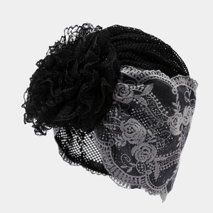 Macro detail of breathable black mesh lace hat with a large 3D fabric flower and rose pattern