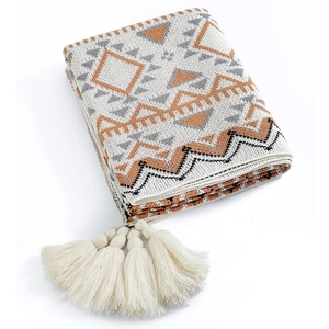 Thick knitted Bohemian Navajo blanket with geometric patterns and fringe tassels
