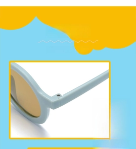 Detailed macro view of the sturdy metal hinge on light blue round children's sunglasses