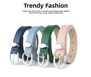 Detail of four colorful PU leather belts with silver oval buckles on white background