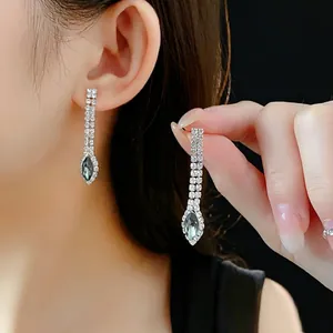 Sparkling tassel drop earrings set with marquise cut stones for formal evening wear