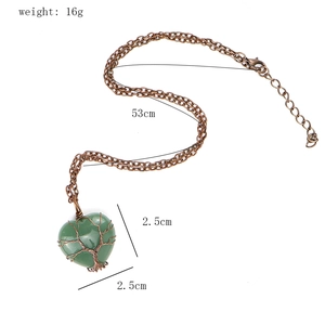 Green aventurine heart pendant with copper tree of life wire wrap showing 2.5cm size