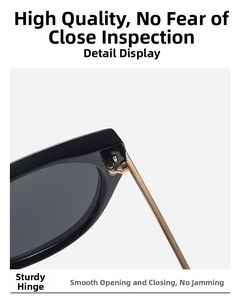 Close-up of durable golden metal hinge on oversized black frame sunglasses