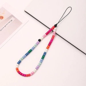 Rainbow beaded phone strap with colorful resin beads and a black lanyard on white surface
