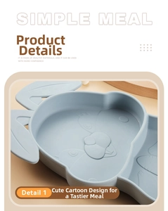 Detail of light blue baby silicone plate with embossed cartoon rabbit and carrot designs