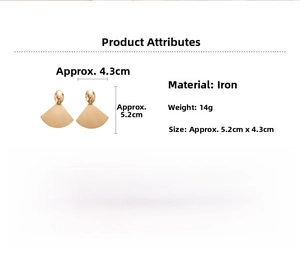 Detail view of gold fan-shaped earrings made of iron, weighing 14g with a brushed finish