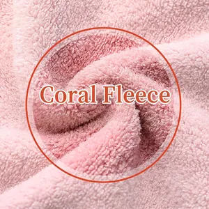 Close-up of thick pink coral fleece fabric showing soft high-density towel material