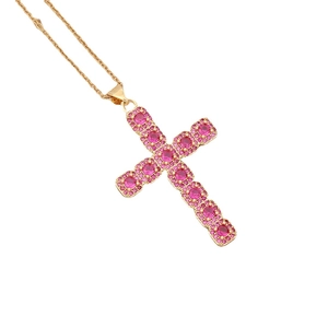 Golden cross necklace with pink zircon crystals on a minimalist chain for women