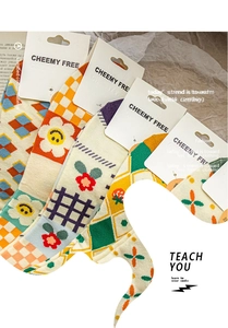 Detail view of retro combed cotton socks with various patterns including floral and grids