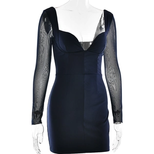Detail of dark blue bodycon dress featuring a deep V-neck and sheer mesh long sleeves