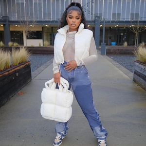 Women's chic white stand-up collar puffer vest and quilted handbag with a trendy streetwear look