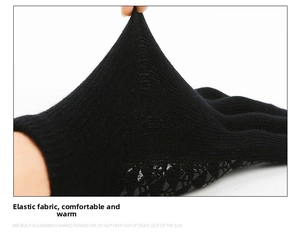 Detail showing elastic black knit fabric and anti-slip grip texture on warm gloves