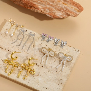 French vintage style bow earrings with pearls and rhinestones in gold and silver finish