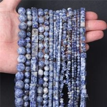 Close-up of assorted sodalite natural stone beads in hand showing size and texture
