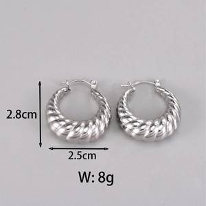 Detailed view of silver crescent earrings with spiral texture and size specifications