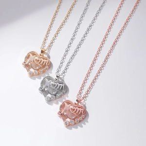 Heart-shaped Mom necklaces in gold, silver and rose gold with diamond accents