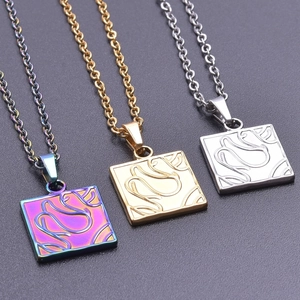 Detailed macro view of square geometric pendants with abstract vortex texture on steel chain