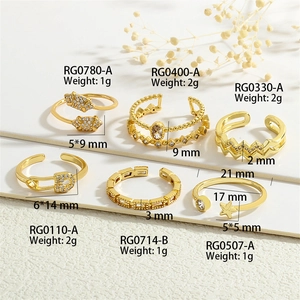 Detailed view of six gold-plated adjustable rings with micro-zirconia insets and weights