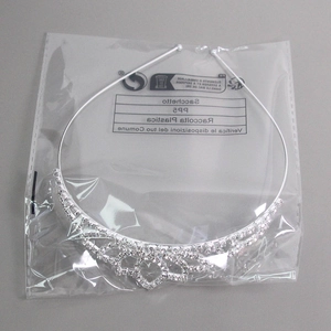 Silver rhinestone crown headpiece for children and brides shown in plastic packaging