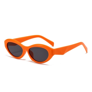 Retro oval sunglasses with orange glossy frames and dark grey lenses in 45-degree view