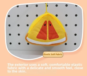 Detail of soft plush fruit coin purse showing the premium elastic fabric and yellow strap