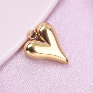 Detailed close-up of a 304 stainless steel puffy heart pendant in polished gold finish