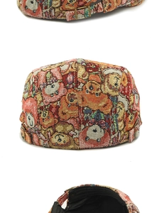 Detail of vintage bear jacquard pattern fabric and adjustable metal buckle on flat cap
