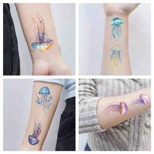 Detail shots of colorful jellyfish temporary tattoos on skin with various ocean styles